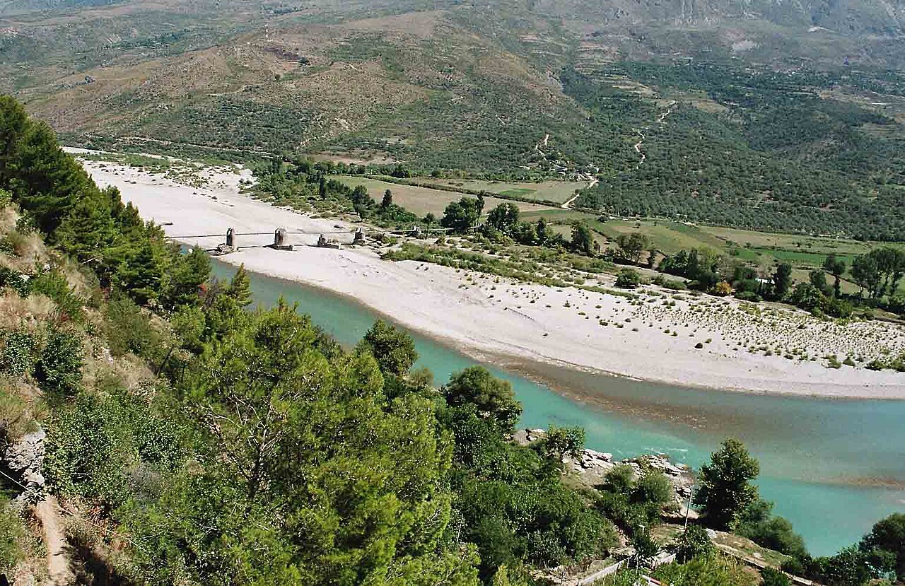 Turquoise braided reaches of the Vjosa River winding through the valley